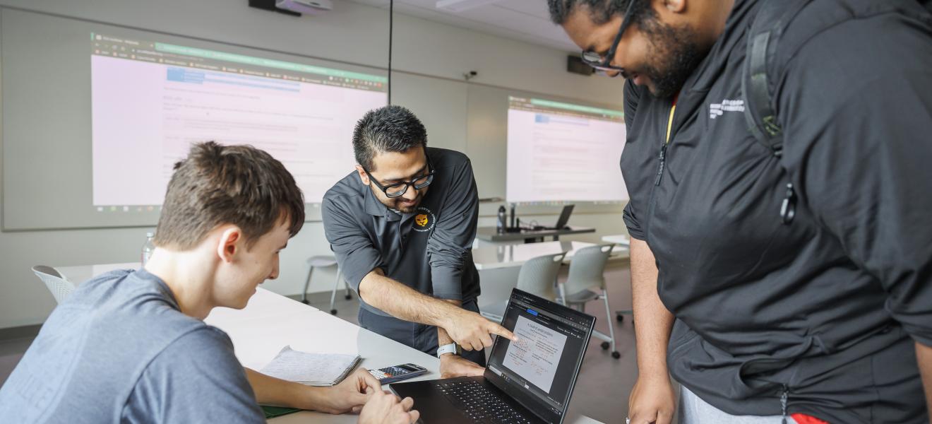 a group of students working on computers