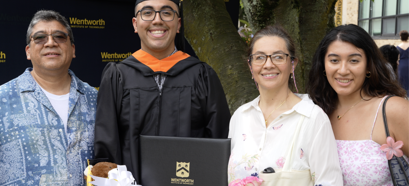 a smiling family at a graduation ceremony