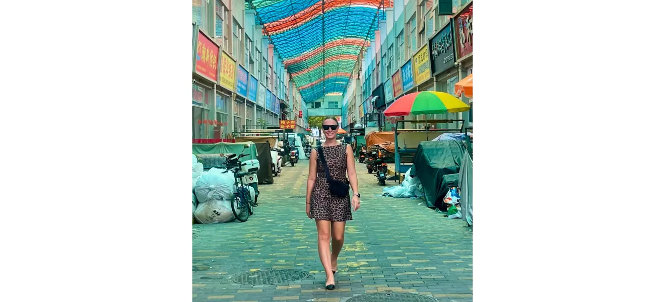 a woman walking down a colorful street