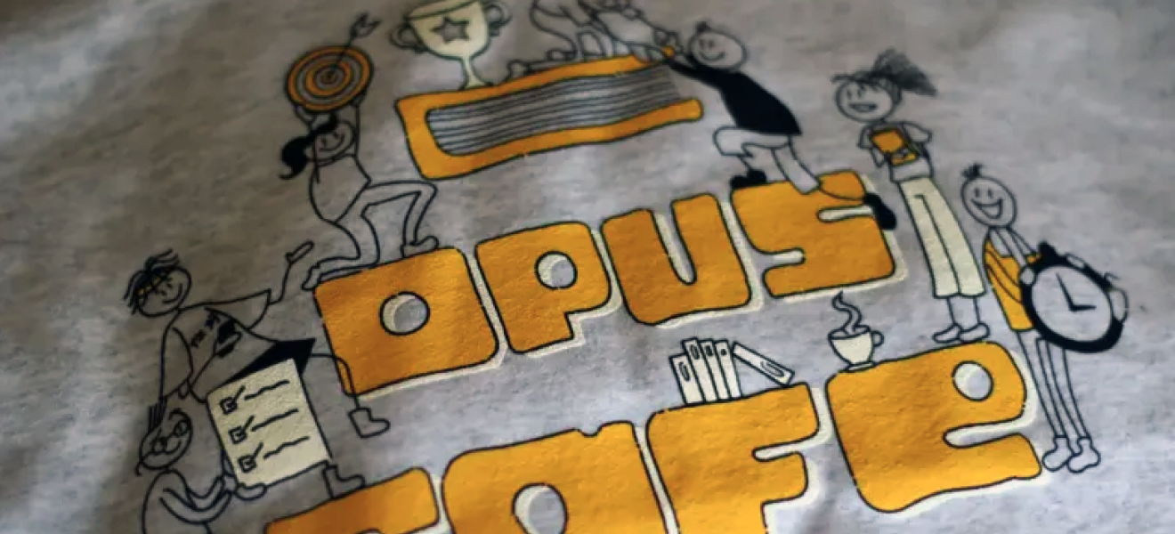 a t-shirt with the words "opus cafe"