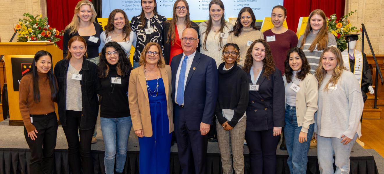 a large group of people posing for the camera