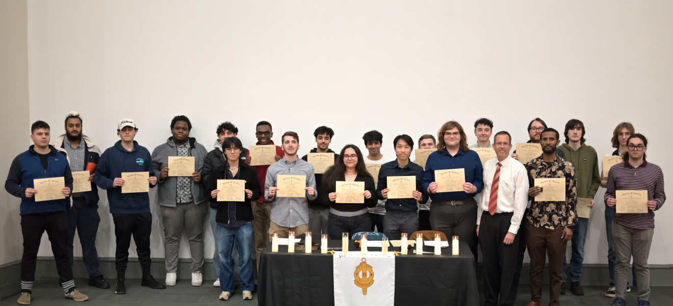 a large group of people holding certificates