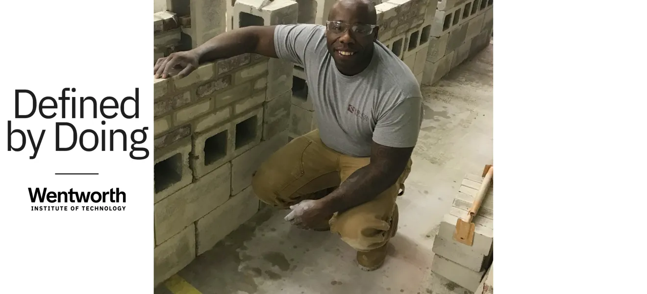 a man squats near concrete