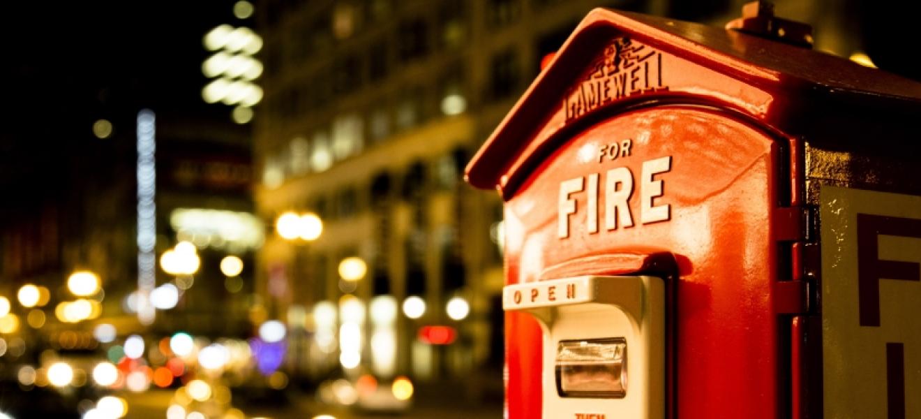 red fire alarm switch at night