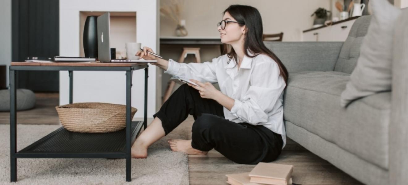 woman sitting in front of table and computer