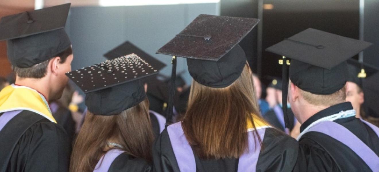 students in graduation caps and gowns