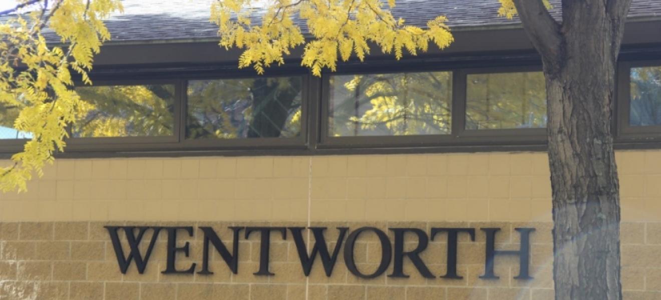 Yellow leaves in front of a Wentworth sign