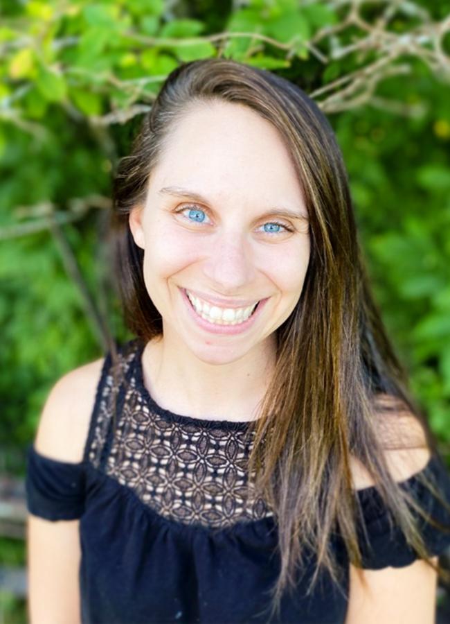 A headshot of Kate Tilas, graduate student