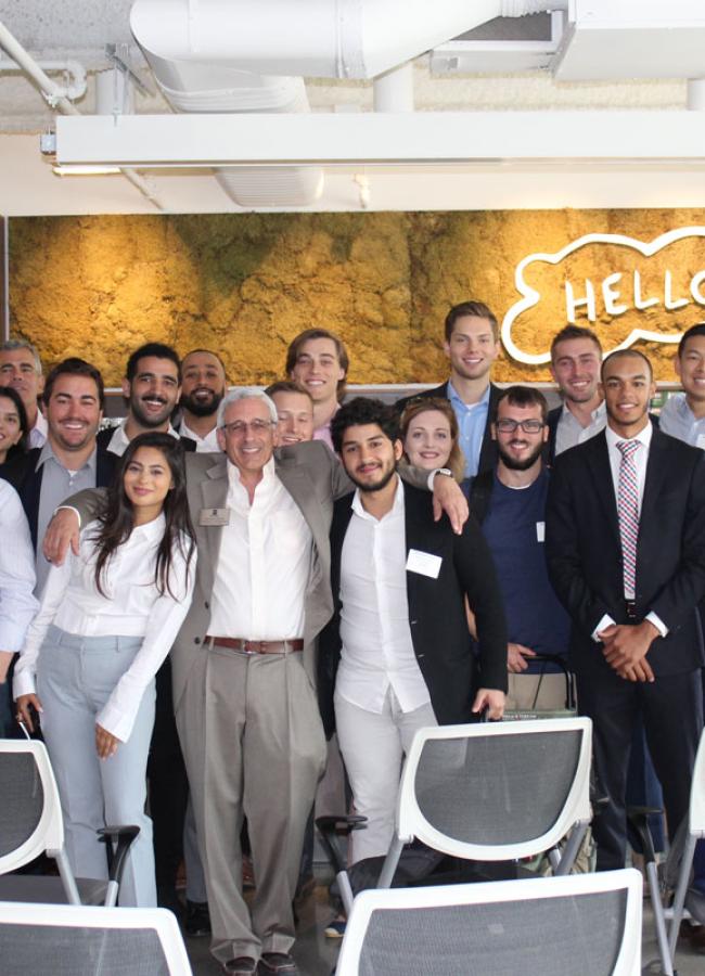 Michael Mozill and his students pose after their capstone presentations