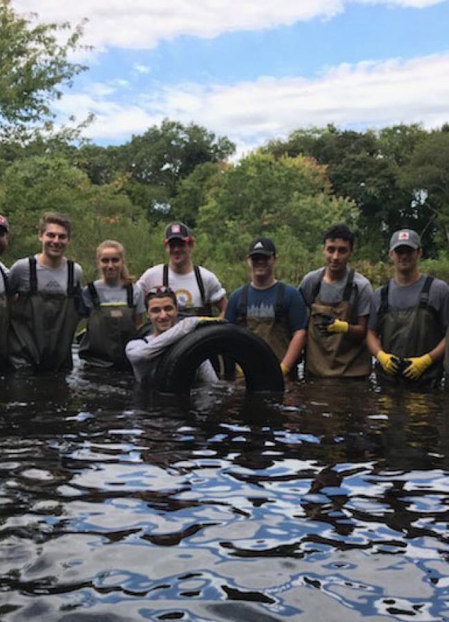 Gautham Das and students cleaning the Neponset River, one of the more satisfying events that I organized for the students. 100 rubber tires were pulled out of the river in 4 hours. 