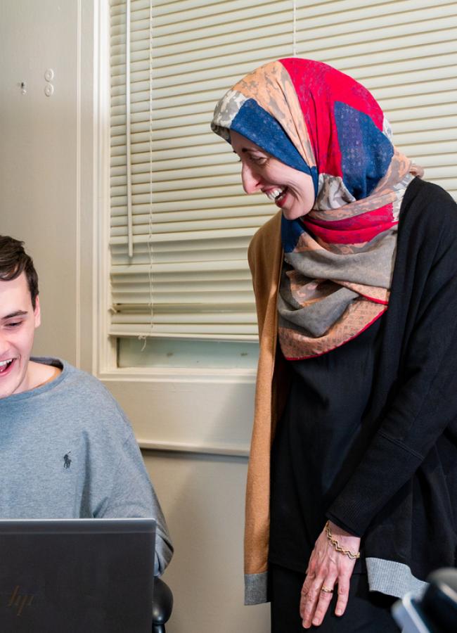 Afsaneh Ghanavati works with an engineering student on a problem in her office