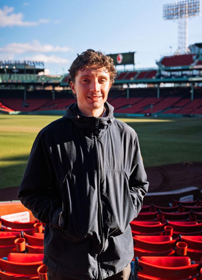 Sam Goy standing in Fenway Park